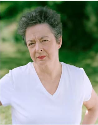 a woman in a white shirt posing for a picture