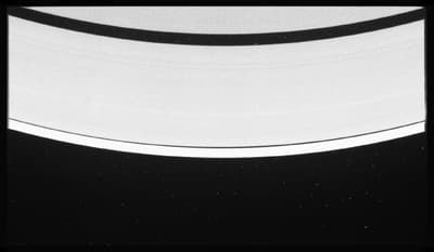 a black and white photo of saturn taken from space
