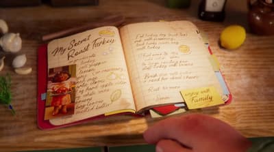 a person holding a book open to a recipe book