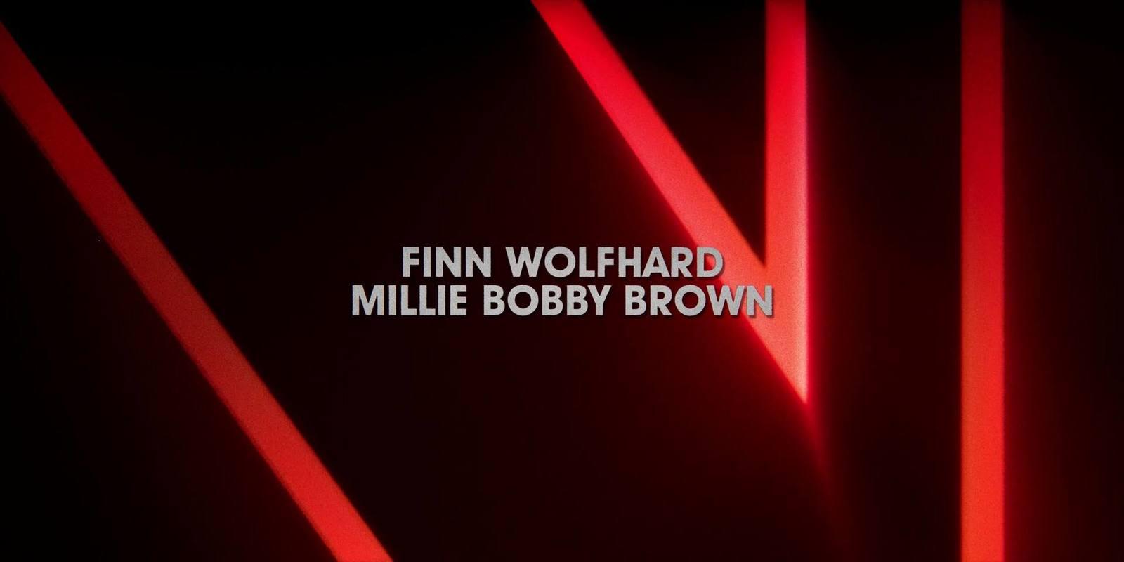a black and red photo with the words finn wolfhard, millie bobby brown