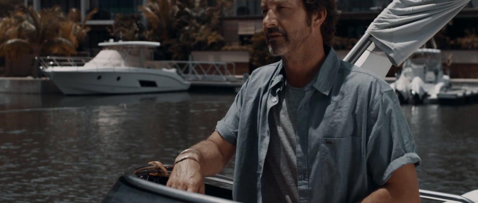 a man in a boat on a body of water