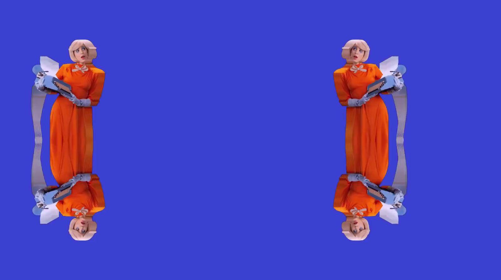 a woman in an orange dress is standing in front of a blue background