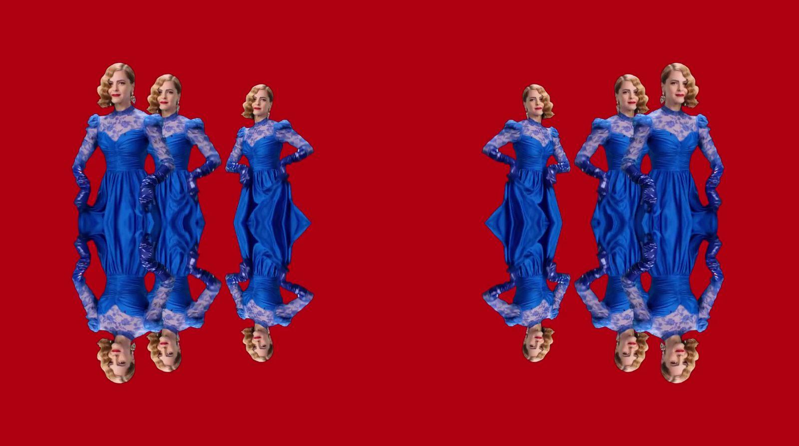 a couple of mannequins dressed in blue dresses