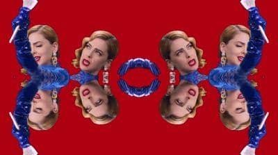 a picture of a woman's face with a red background