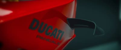 a close up of a red duc motorcycle
