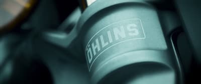 a close up of a metal object with a name on it