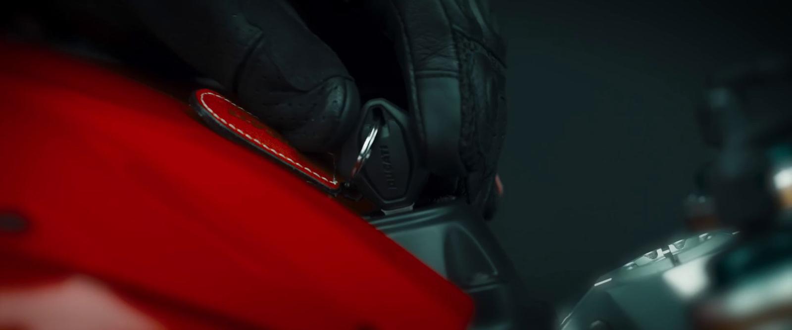 a close up of a red suitcase with a black background