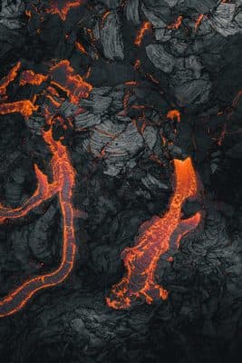 an aerial view of a lava flow in the ocean