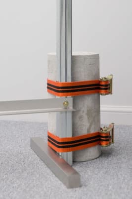 a couple of poles with orange and black straps on them