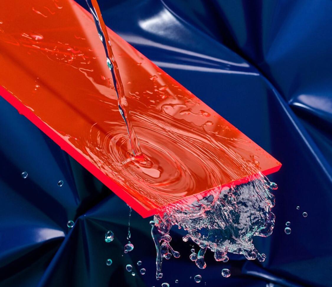 a red object with water splashing out of it
