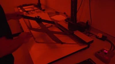 a person is working on a project with a red light