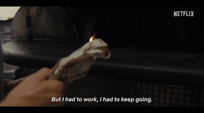 a person holding a piece of paper in their hand