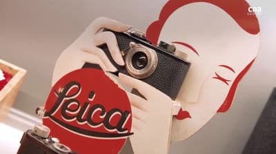 a close up of a person holding a camera