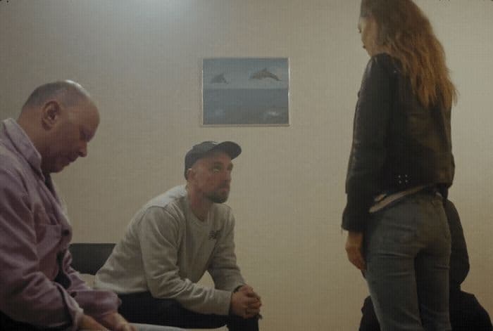 a group of people sitting in a room