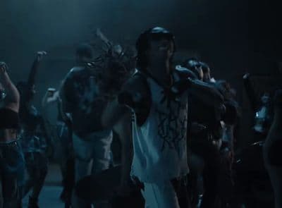 a group of people dancing in a dark room