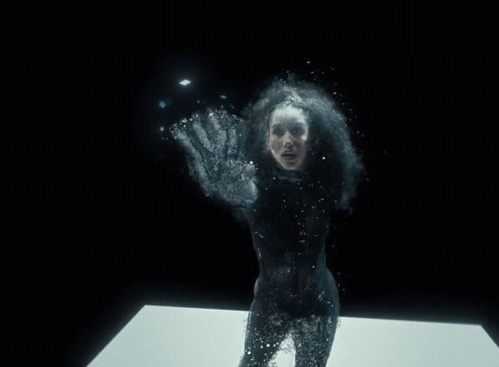 a woman standing on top of a white table under water