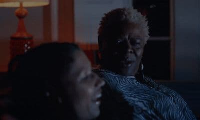 a couple of women sitting next to each other
