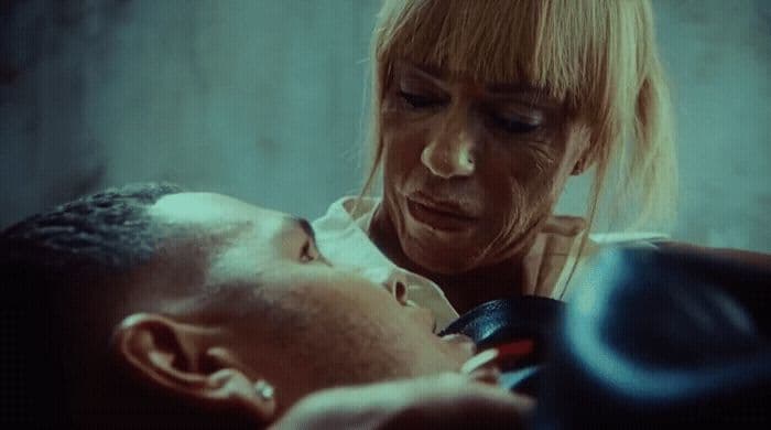a man and a woman who are looking at each other