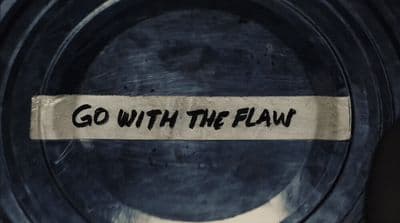 a piece of paper that says go with the flow on it