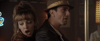 a man and a woman standing next to each other