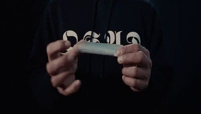 a person holding a cell phone in their hands