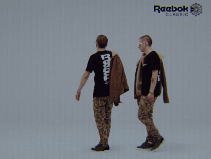 a couple of men standing next to each other