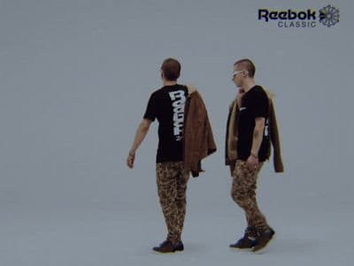 a couple of men standing next to each other
