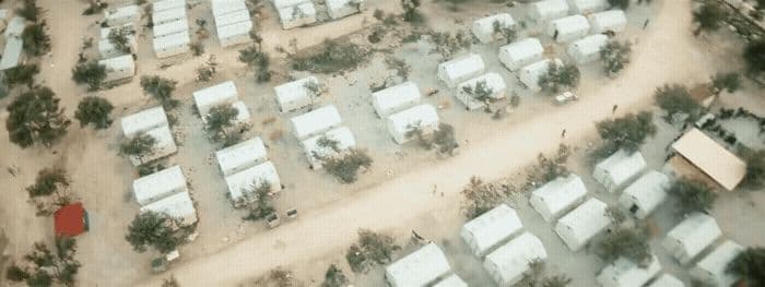 an aerial view of a lot of houses and trees