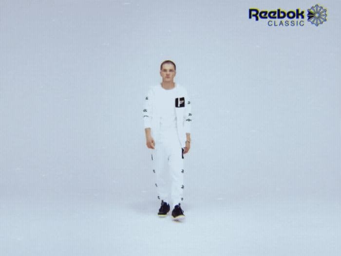 a man standing in front of a white background