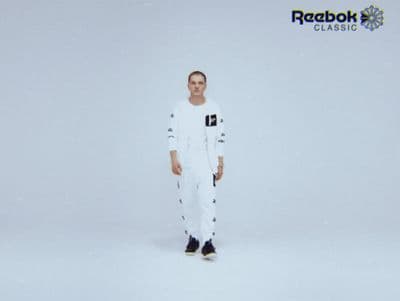 a man standing in front of a white background