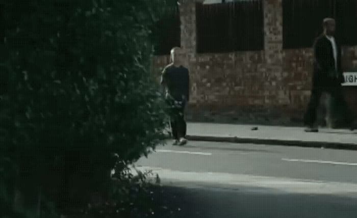 a couple of men walking down a street