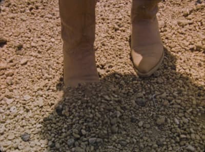 a person standing in a pile of rocks