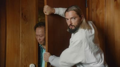 a man in a white shirt and a man in a blue tie