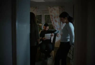 a man and a woman standing in a room