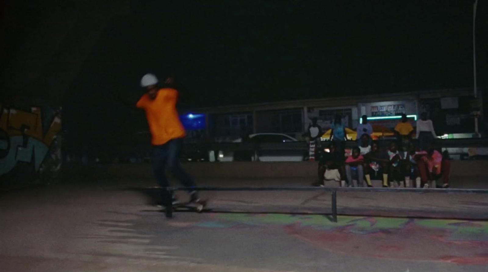 a man riding a skateboard on top of a metal rail