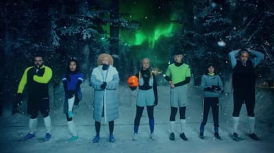 a group of people standing next to each other in the snow