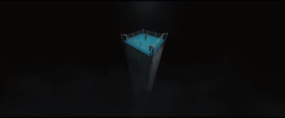 an aerial view of a swimming pool at night