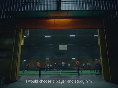 a group of people playing a game of soccer