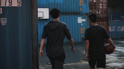 a couple of men standing next to each other