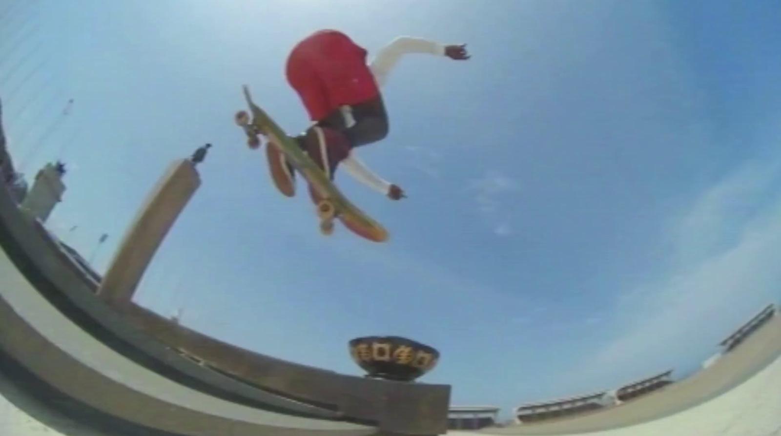 a man flying through the air while riding a skateboard