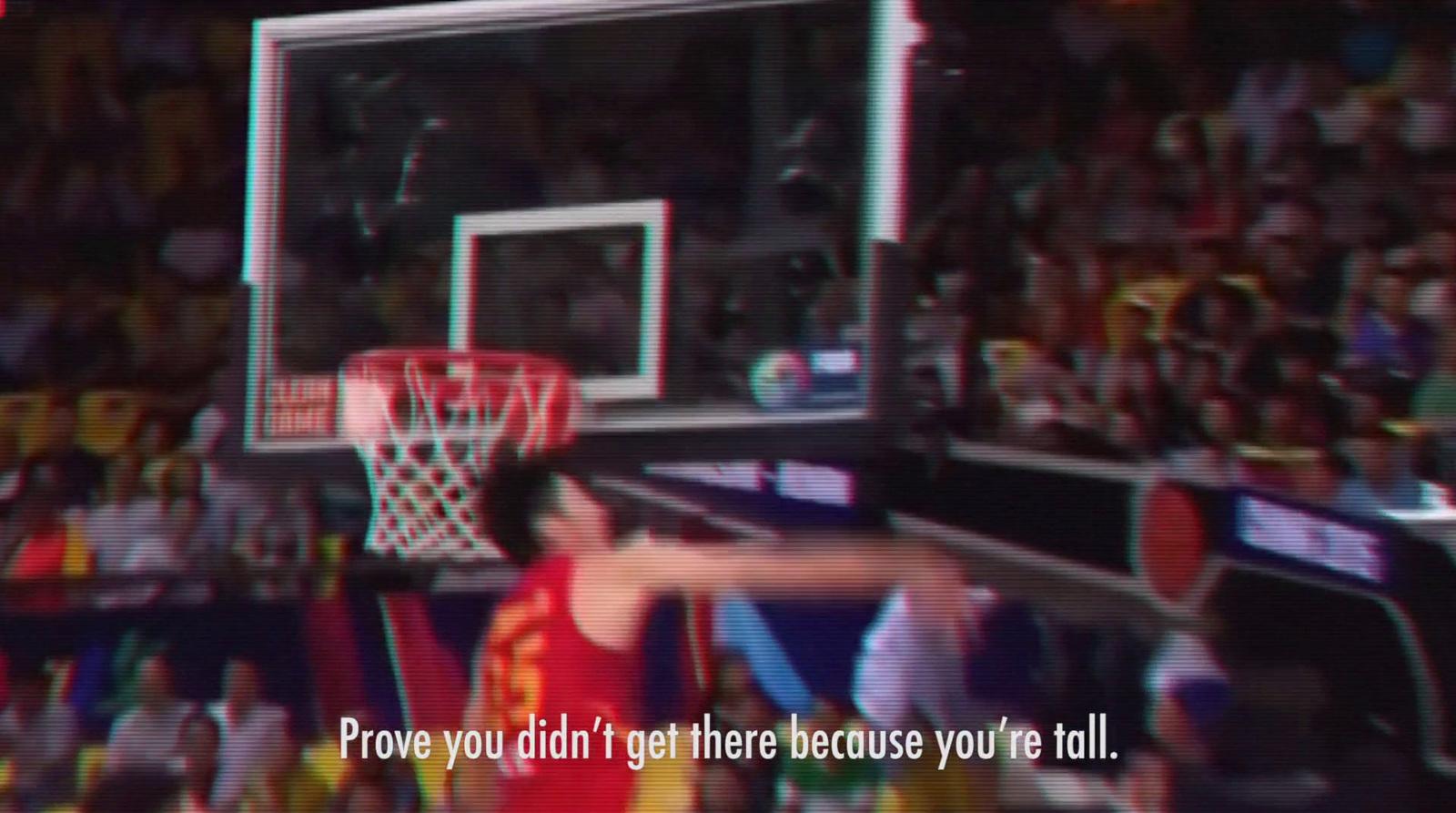 a basketball player is about to dunk the ball