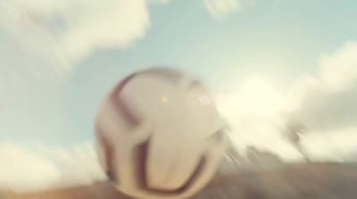 a blurry photo of a soccer ball in the air