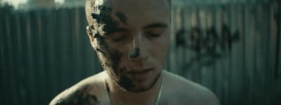 a man with mud all over his face