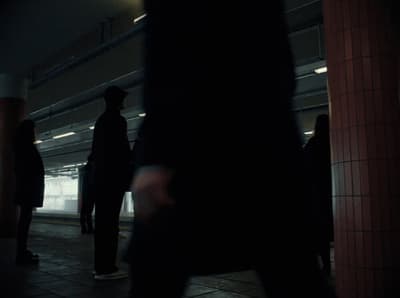 a group of people standing on a subway platform