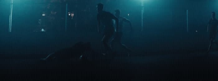 a group of people standing in a dark room