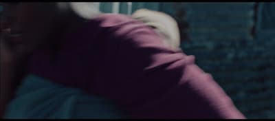 a blurry photo of a person looking out a window