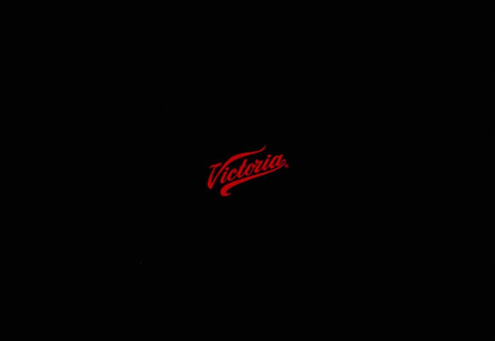 a black background with a red logo on it