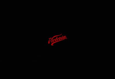 a black background with a red logo on it