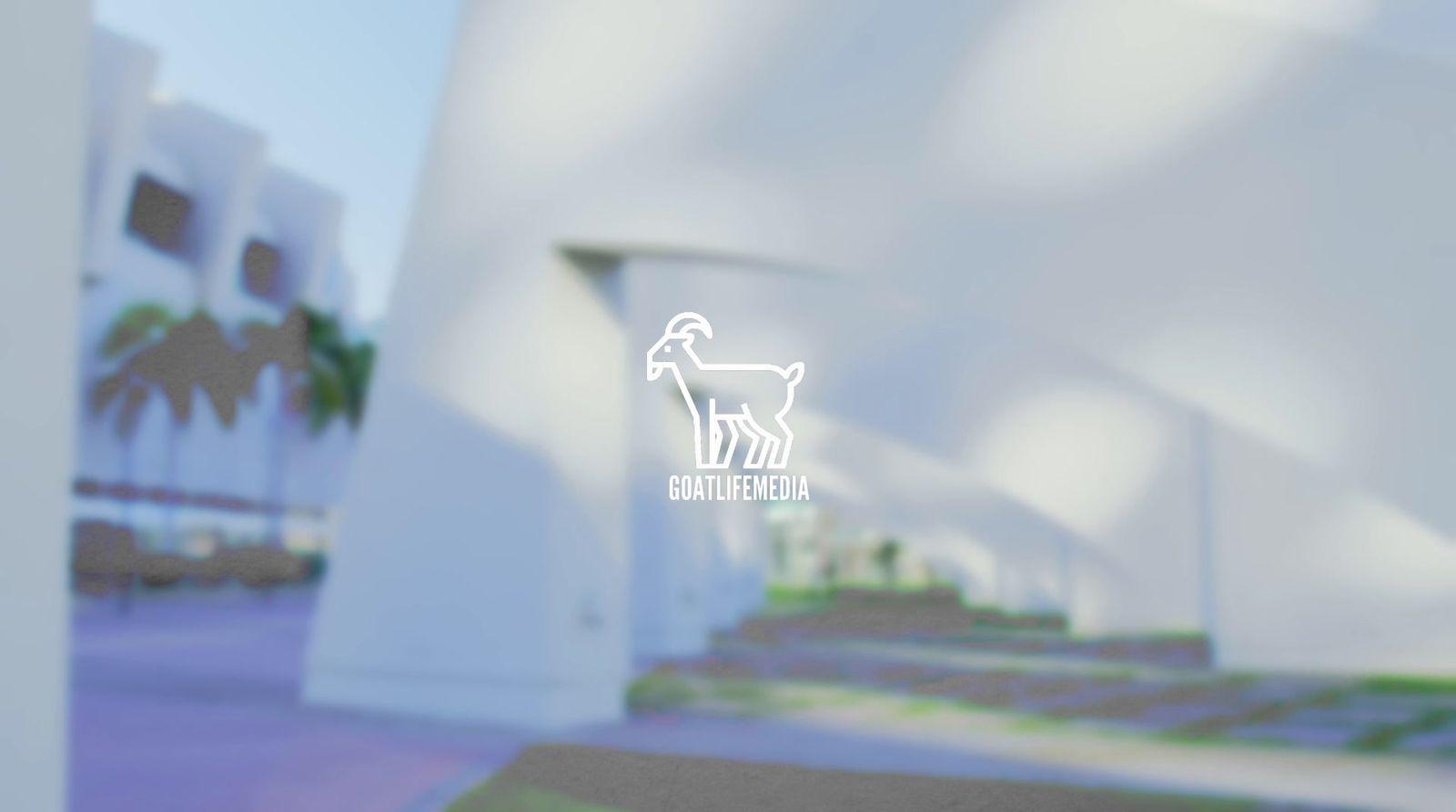 a blurry photo of a building with a goat on it