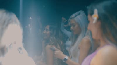 a group of women standing next to each other